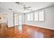 Open floor plan with wood-look floors connecting living spaces at 9987 Shiloh Heights St, Las Vegas, NV 89178