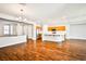 Spacious open-concept living space showcasing hardwood floors, neutral tones, and a modern kitchen at 9987 Shiloh Heights St, Las Vegas, NV 89178