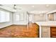 Open-concept living area with hardwood floors, natural light, and access to the kitchen and dining at 9987 Shiloh Heights St, Las Vegas, NV 89178