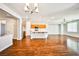 Open living space featuring hardwood floors, connecting the kitchen, dining, and living areas seamlessly at 9987 Shiloh Heights St, Las Vegas, NV 89178