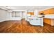 Hardwood floors flow through an open concept living area and gourmet kitchen with stylish countertops at 9987 Shiloh Heights St, Las Vegas, NV 89178
