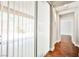 Hallway with patio doors, wood-look floors and neutral colors at 9987 Shiloh Heights St, Las Vegas, NV 89178