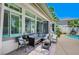 Backyard featuring outdoor seating, covered patio, pool, spa, and mature trees at 10249 Wisteria Hills Ct, Las Vegas, NV 89135