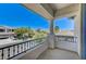 Relaxing balcony with wrought iron railing and stucco columns, offering serene neighborhood views at 10249 Wisteria Hills Ct, Las Vegas, NV 89135