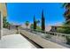 Spacious balcony featuring wrought iron railing and beautiful views of palm trees and neighborhood at 10249 Wisteria Hills Ct, Las Vegas, NV 89135