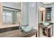 This bathroom features double sinks with granite counters and fixtures at 10249 Wisteria Hills Ct, Las Vegas, NV 89135