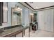This bathroom features double sinks with granite counters and a walk-in shower at 10249 Wisteria Hills Ct, Las Vegas, NV 89135