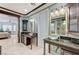 Ensuite bathroom featuring dual vanities with glass vessel sinks and granite countertops at 10249 Wisteria Hills Ct, Las Vegas, NV 89135