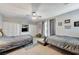 Spacious bedroom with built-in cabinets, two beds, and access to a balcony for natural light at 10249 Wisteria Hills Ct, Las Vegas, NV 89135