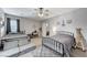 Spacious bedroom featuring two beds, neutral walls, carpet, and ample natural light at 10249 Wisteria Hills Ct, Las Vegas, NV 89135