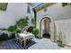 Charming outdoor dining area with stone tile and shaded patio at 10249 Wisteria Hills Ct, Las Vegas, NV 89135
