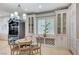 Charming dining area with built-in cabinetry and a chandelier at 10249 Wisteria Hills Ct, Las Vegas, NV 89135