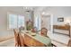 Dining room with a light chandelier, buffet, and large shutters at 10249 Wisteria Hills Ct, Las Vegas, NV 89135