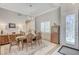 Elegant dining room with stylish chandelier, built-in cabinet, and neutral color palette at 10249 Wisteria Hills Ct, Las Vegas, NV 89135