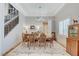 Formal dining room featuring a staircase, neutral color palette, and abundant natural light at 10249 Wisteria Hills Ct, Las Vegas, NV 89135