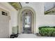 Inviting gated entryway featuring an arched gate and decorative stonework at 10249 Wisteria Hills Ct, Las Vegas, NV 89135