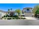 Charming two-story home featuring a well-manicured lawn and a two car garage at 10249 Wisteria Hills Ct, Las Vegas, NV 89135