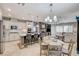 Open concept kitchen featuring an island with seating and adjacent living area at 10249 Wisteria Hills Ct, Las Vegas, NV 89135