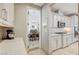 Bright kitchen with marble countertops and tile backsplash, with a dining room visible through the doorway at 10249 Wisteria Hills Ct, Las Vegas, NV 89135