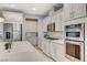 Gourmet kitchen featuring stainless steel appliances and sleek countertops at 10249 Wisteria Hills Ct, Las Vegas, NV 89135