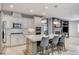Bright kitchen featuring white cabinets, a center island, and stainless steel appliances at 10249 Wisteria Hills Ct, Las Vegas, NV 89135