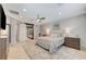 Serene main bedroom with a ceiling fan, ensuite bath access, and ample natural light at 10249 Wisteria Hills Ct, Las Vegas, NV 89135