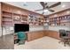 This office includes custom cabinets, a ceiling fan, and natural light at 10249 Wisteria Hills Ct, Las Vegas, NV 89135