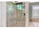 This walk-in shower has many sprayers and beautiful tile at 10249 Wisteria Hills Ct, Las Vegas, NV 89135
