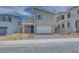 Stylish modern home with a two-car garage and inviting stone-accented entrance at 10465 Smokey Mariposa, Las Vegas, NV 89166