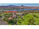 Stunning aerial view of a home near a golf course, lake, and mountains, showcasing luxury living at 12 Strada Di Circolo, Henderson, NV 89011