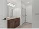 Bathroom with granite countertops and a decorative light fixture above sink at 12 Strada Di Circolo, Henderson, NV 89011