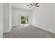 Spacious bedroom with neutral carpet and access to the outdoor patio at 12 Strada Di Circolo, Henderson, NV 89011