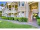 Beautiful building exterior featuring balconies, stairs and green grass at 12 Strada Di Circolo, Henderson, NV 89011