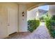 Charming townhouse entrance with brick walkway, lush hedges, and mountain views at 12 Strada Di Circolo, Henderson, NV 89011