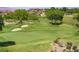Scenic view of a pristine golf course featuring manicured greens, sand traps, and lush landscaping at 12 Strada Di Circolo, Henderson, NV 89011