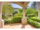 Charming patio view with lush landscaping and attractive column at 12 Strada Di Circolo, Henderson, NV 89011
