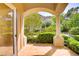 Covered patio showing tile flooring, garden views, and decorative pillar at 12 Strada Di Circolo, Henderson, NV 89011