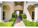 Elegant walkway flanked by manicured hedges, creating a welcoming path to this beautiful home at 12 Strada Di Circolo, Henderson, NV 89011