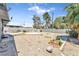 View of the gravel landscaped backyard featuring stepping stones, surrounded by a block wall at 1713 E Bonanza Rd, Las Vegas, NV 89101