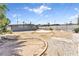 Spacious backyard featuring gravel landscaping, a patio area, and mature trees at 1713 E Bonanza Rd, Las Vegas, NV 89101