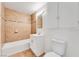 Cozy bathroom features a tub, tiled shower, and a vanity with bright lighting at 1713 E Bonanza Rd, Las Vegas, NV 89101