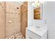 Bathroom with tiled shower, mosaic accent, and modern vanity with storage at 1713 E Bonanza Rd, Las Vegas, NV 89101