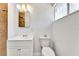 Updated bathroom featuring a vanity, toilet, and decorative tile accents at 1713 E Bonanza Rd, Las Vegas, NV 89101