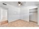 Cozy bedroom features a ceiling fan, closet, and tile flooring for easy maintenance at 1713 E Bonanza Rd, Las Vegas, NV 89101