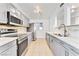 Well-lit kitchen showcasing stainless steel appliances, modern cabinets, and stylish countertops at 1713 E Bonanza Rd, Las Vegas, NV 89101
