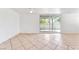 Bright living room with sliding glass doors to patio, tile floor and lots of light at 1713 E Bonanza Rd, Las Vegas, NV 89101