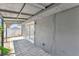 Covered patio area featuring a tile floor, security gate, and access to the backyard at 1713 E Bonanza Rd, Las Vegas, NV 89101