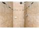 Shower with neutral toned tiling, mosaic accent, and handheld shower head at 1713 E Bonanza Rd, Las Vegas, NV 89101