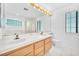 Bathroom featuring double sinks, large mirror and shower-tub combination at 1951 Moyer Dr, Henderson, NV 89074