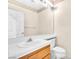 Bright bathroom featuring single sink vanity with a large mirror at 1951 Moyer Dr, Henderson, NV 89074